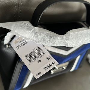 Michael Kors Whitney medium satchel. Exposed stitching, leather and velvet.